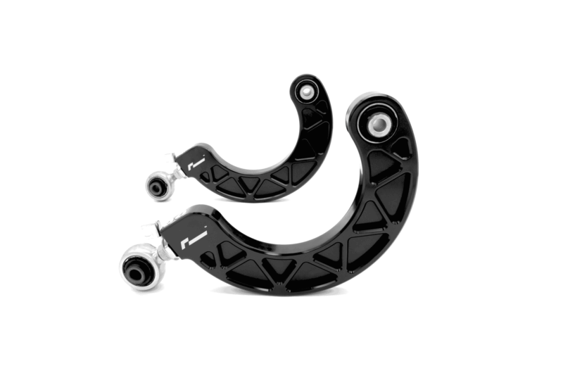 Close-up of black curved mechanical joints with circular bearings, likely part of a wearable brace.