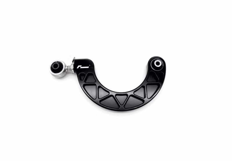Close-up of a black curved mechanical component with two white circular bearings at each end on a white background, viewed from above.)