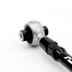 Close-up of a metal wrench head attached to a black handle on a white background, showing a chrome finish and socket.