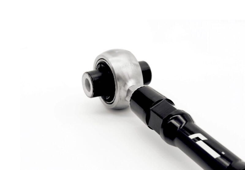 Close-up of a metal wrench head attached to a black handle on a white background, showing a chrome finish and socket.