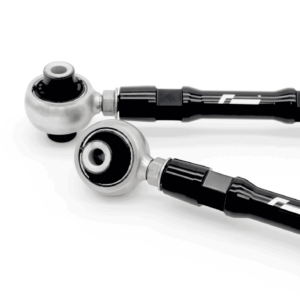Close-up of a chrome ball joint connected to a black textured handle with a cable