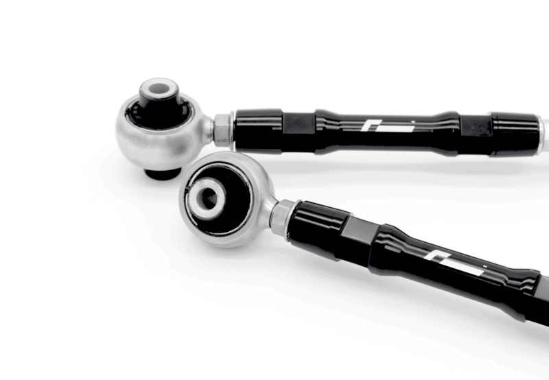 Close-up of a chrome ball joint connected to a black textured handle with a cable