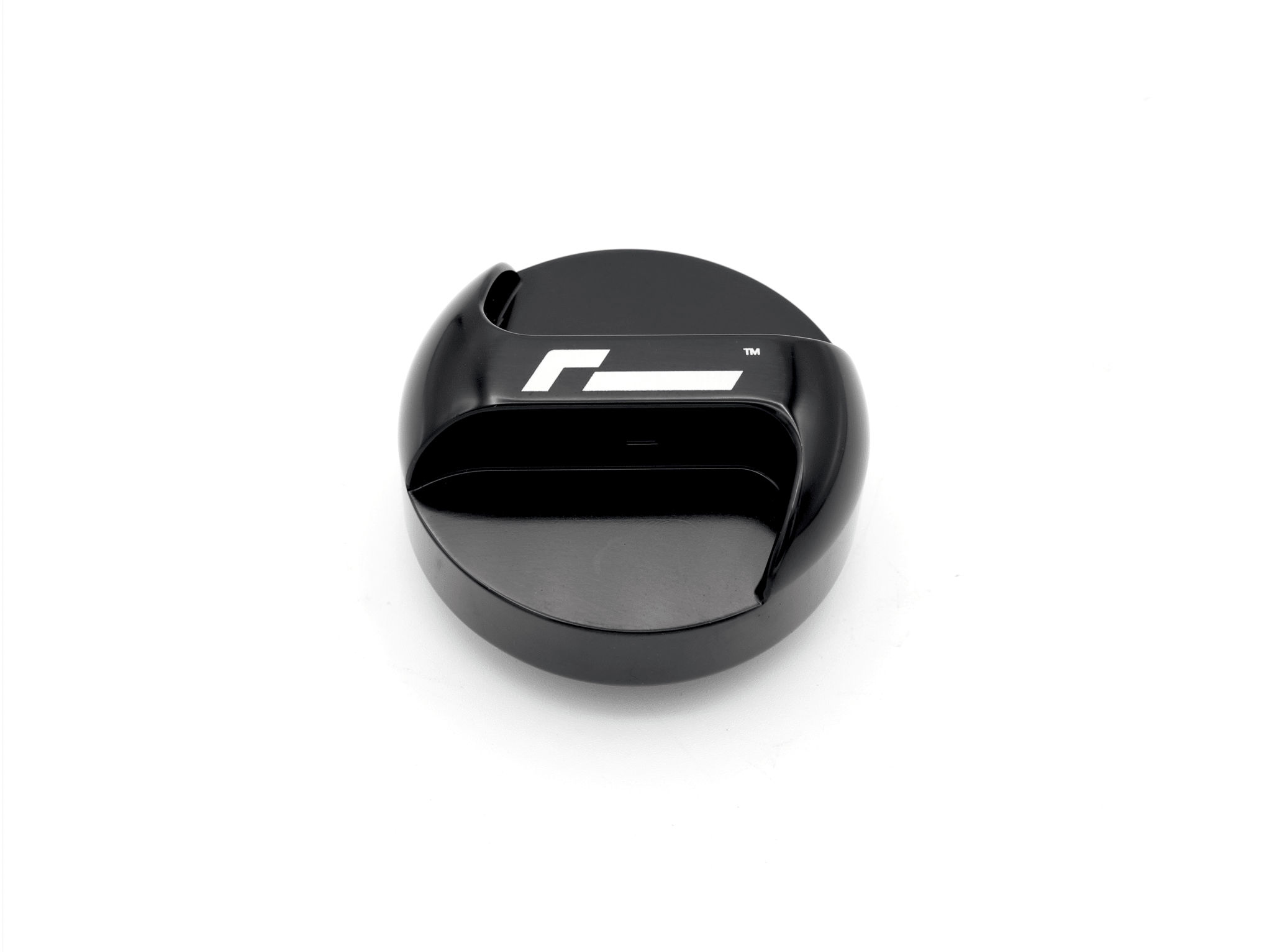 oil-cap-gen4-mqb-evo_51746401271_o-1png - OPSHOLDERS Close-up of a glossy black circular gadget with a white stylized logo on the top surface.