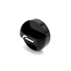 oil-cap-gen4-mqb-evo_51747283960_o-1png - OPSHOLDERS Close-up of a glossy black circular device with a white stripe, on a white background, viewed at an angle.