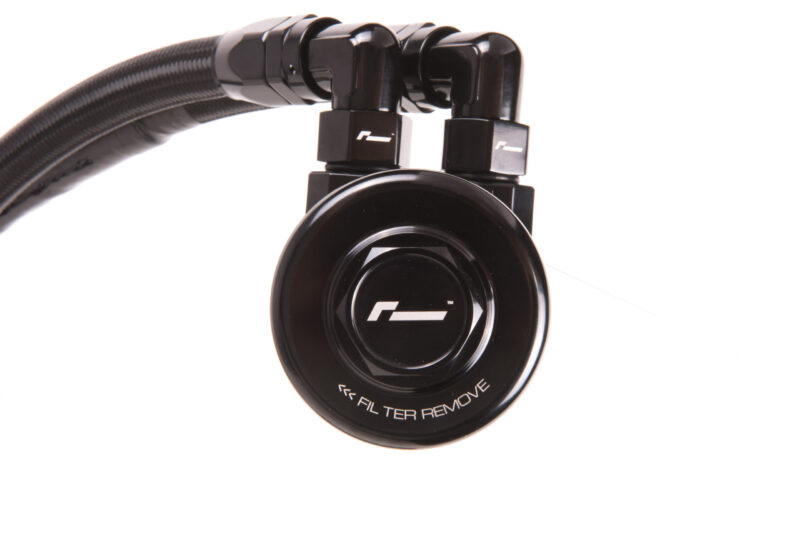 oil-cooler-vwr18-g700_42420027305_o-scaled-1jpg - OPSHOLDERS Close-up of black over-ear headphones with a coiled cable and glossy ear cup showing a white logo on a white background.