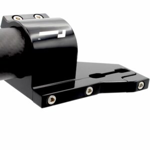 Close-up of a glossy black camera tripod quick-release plate with two exposed screws on top and a carbon‑fiber-like grip arriving from the left.