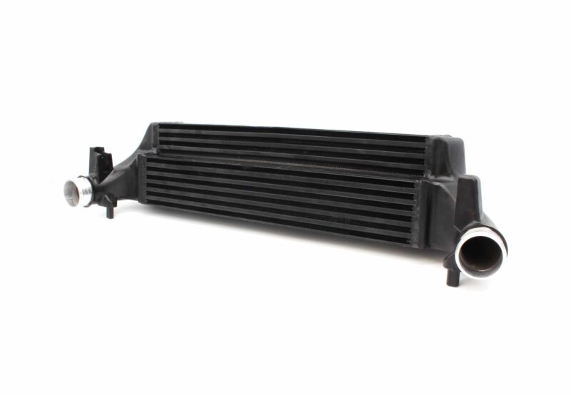 polo-gti-aw-intercooler_53247202052_o-1jpg - OPSHOLDERS Black automotive intercooler core with side inlet and outlet hoses visible on each end, oriented horizontally.
