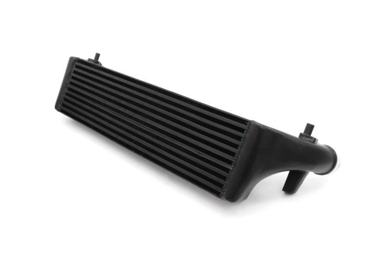 polo-gti-aw-intercooler_53248375243_o-scaled-2jpg - OPSHOLDERS Close-up of a black automotive radiator core with visible cooling fins, angled view