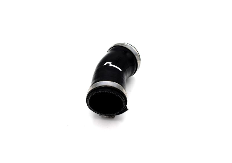 Close-up of a black camera lens with silver metal rings on a white background, shown at an angle.