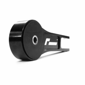 Close-up of a black retractable tape measure, showing the round housing and part of the metal blade plate edge outside the case.