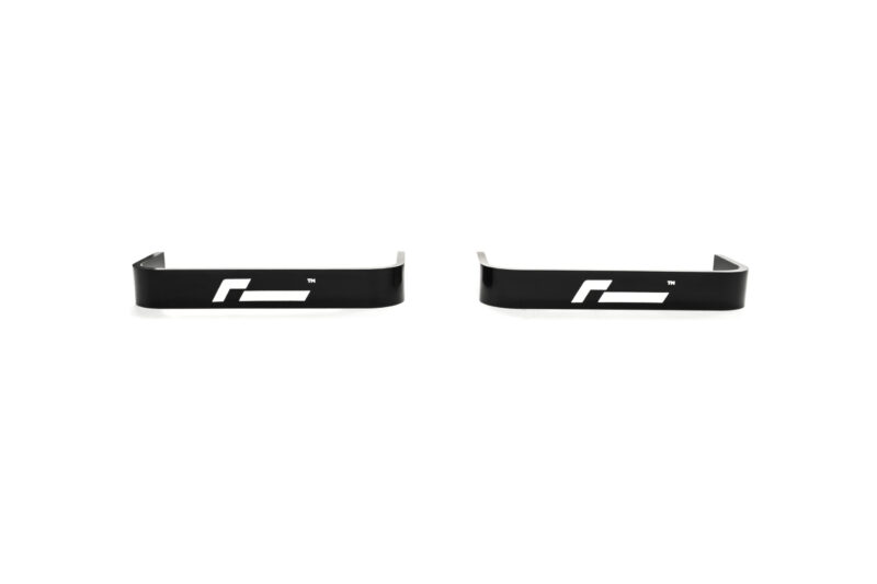propshaft-bearing-alignment-kit_51769412225_o-scaled-2jpg - OPSHOLDERS Pair of black curved metal brackets with a white logo on each, set against a white background.