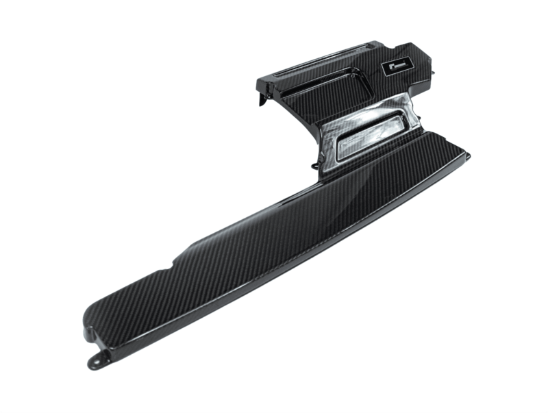 Close-up of a glossy carbon fiber winglet or attachment with mounting flange and ridge details