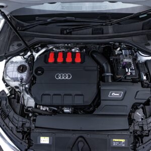 r600-evo_51817392042_o-scaled-2jpg - OPSHOLDERS Open car hood shows an engine bay with a black cover featuring four red-tipped ignition coil covers and Audi rings badge in the center of the engine bay.