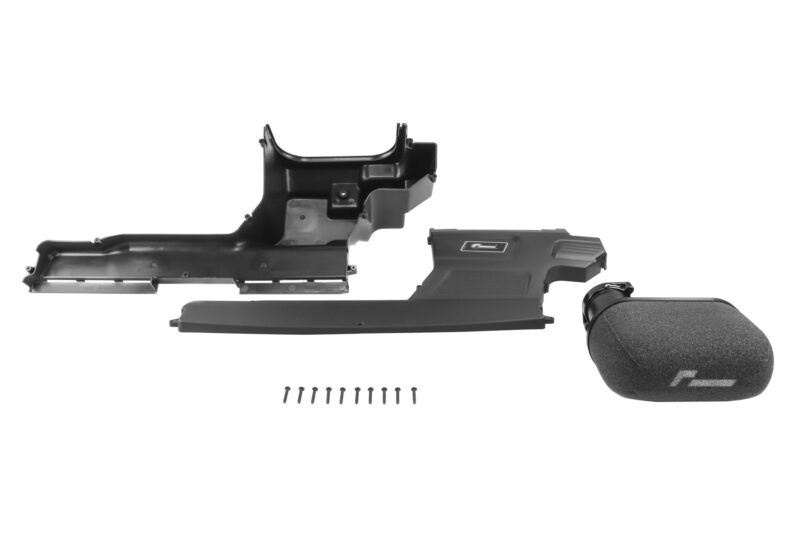 Disassembled vehicle interior trim parts: dash panels, center console piece, and a foam-covered microphone with screws laid out nearby