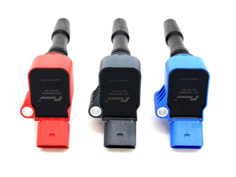 Three color-coded automotive fuel injectors (red, gray, blue) lined up on a white background.