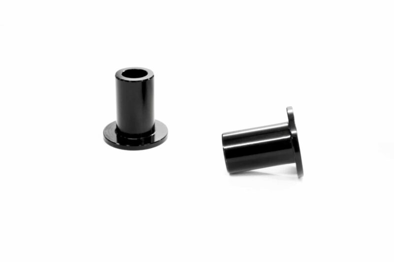 racingline-front-subframe-brace-13_51826108363_o-scaled-2jpg - OPSHOLDERS Two black metal cylindrical components on a white background; one upright with a hollow top and circular base, the other tilted to the side with a flange at its end.