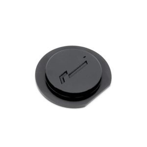 Black circular control knob with a horizontal slot, viewed from above (top-down angle)