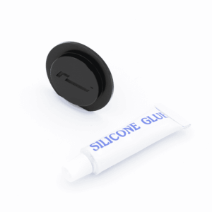 Round black wireless charging pad beside a white tube labeled Silicone Glue on a white background.