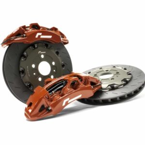 Orange brake calipers over black ventilated brake discs, automotive braking system