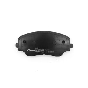 Curved brake pad with visible wear surface and stamped codes on the metal backing plate.