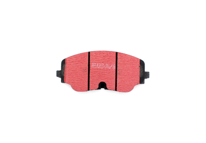 Close-up of a red brake pad with black edges, viewed from the front.