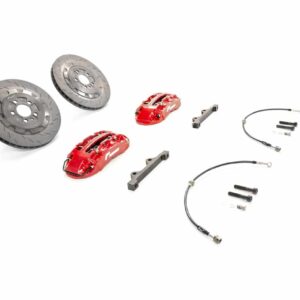 Two ventilated brake rotors, red calipers, mounting brackets, and braided brake lines with fittings laid out.