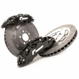 Two ventilated brake discs with black high-performance calipers resting on a white background.