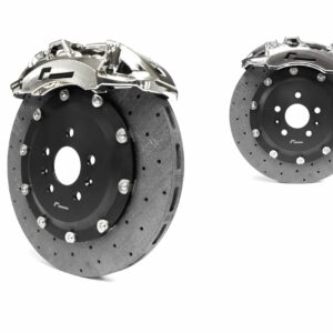 stage-3-ccm-brake-kit_50585982268_o-scaled-2jpg - OPSHOLDERS Pair of ventilated brake rotors with silver calipers displayed against a white background, automotive part shot for a catalog moment.