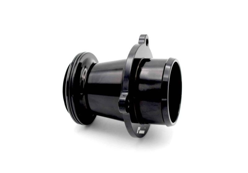 Close-up of a glossy black metal pipe fitting with a mounting tab and circular openings.