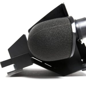 Close-up of a black studio microphone with foam windscreen mounted on a metal stand.