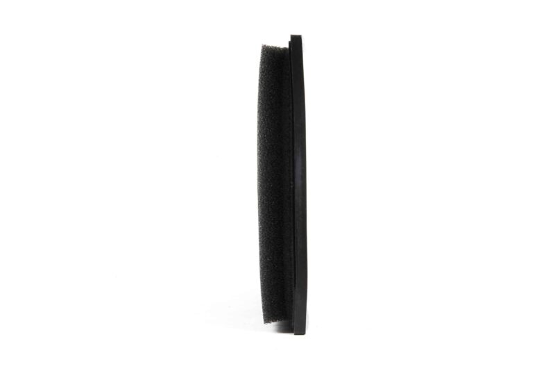 Close-up of a black, foam-textured vertical rod standing upright on a white background.