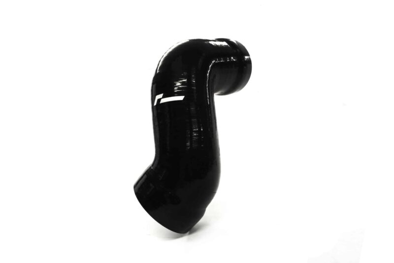 Close-up of a shiny black curved object on a white background.