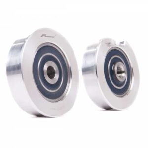 Two silver metal ball bearings of different sizes resting on a white background.