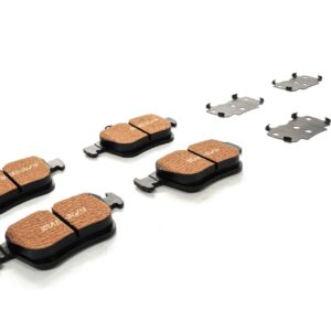 Set of copper-colored disc brake pads with metal shims laid out on a white background, for a bike or vehicle braking system.