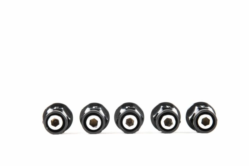 wheelnuts-20_45145251834_o-1jpg - OPSHOLDERS Five black lug nuts lined up horizontally on a white background.
