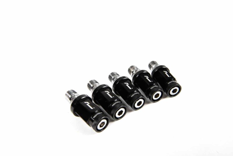 wheelnuts-8_45869602971_o-1jpg - OPSHOLDERS Five black cylindrical adapters with silver threaded ends lined up diagonally on a white background.