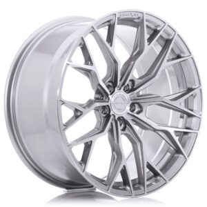 Silver multi-spoke alloy car wheel with an angular, geometric design