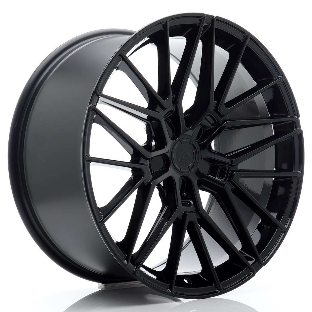 52804_0_39167jpg - OPSHOLDERS Black glossy multi-spoke alloy car wheel rim shown at an angle, highlighting its concave design and lip edge.