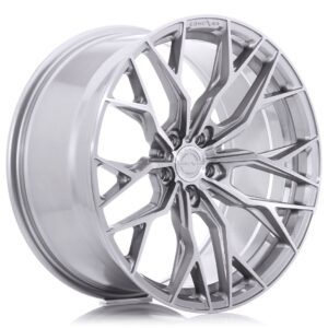 Shiny silver multi-spoke alloy car wheel rim photographed at an angle, showing detailed design and central hub