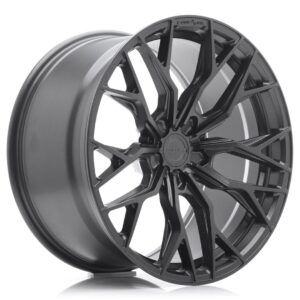 Black glossy alloy wheel with an intricate multi-spoke design, shown at an angle to highlight the spokes and center hub