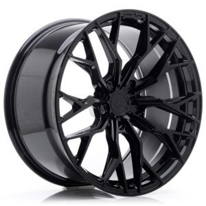 Glossy black alloy car wheel rim with an intricate multi-spoke design