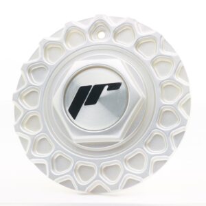 Close-up of a white, honeycomb-pattern wheel rim with a central metal cap displaying a dark geometric logo corner mark.