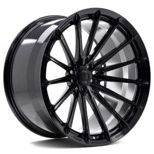 Black glossy, multi-spoke forged alloy wheel (car wheel) viewed at an angle, highlighting its intricate spoke pattern and central hub cap.