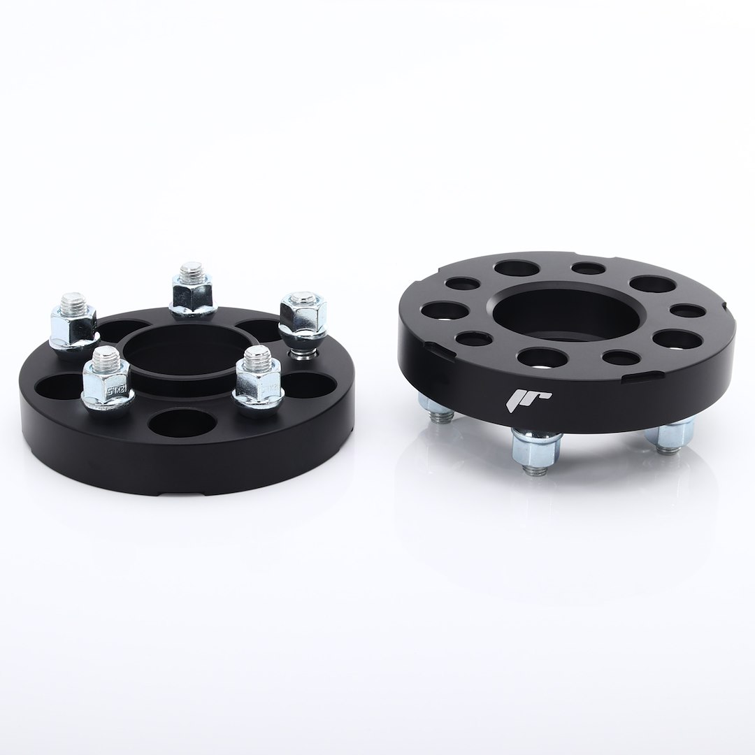 54769_0_39395jpg - OPSHOLDERS Pair of black wheel spacers with studs and nuts on a white surface, used to adjust wheel offset in vehicles.
