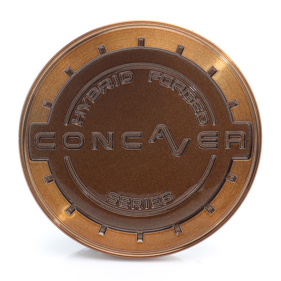 55306_0_39665jpg - OPSHOLDERS Bronze circular token with embossed text reading 'Hybrid Forged' at the top and 'Series' at the bottom, featuring a large stylized word across the center.