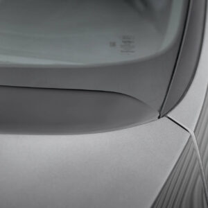 Close-up of a silver car's rear window and trunk area, with a thin cord running along the edge.