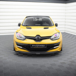pol_po_Bonnet-Vents-459_1jpg - OPSHOLDERS Front view of a bright yellow Renault car parked indoors against white corrugated walls, showing the grille, headlights, and a black license plate reading #MAXTONIZED.