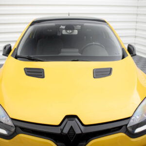 Front view of a bright yellow car with a black grille, shown indoors on a checkered floor with a sleek hood and headlights visible