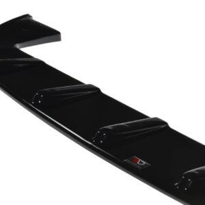 Close-up of a glossy black car spoiler with a small red-and-white badge visible along the edge.
