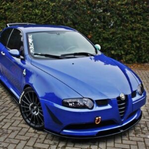 pol_po_FRONT-SPLITTER-suitable-for-Alfa-Romeo-147-GTA-621_4jpg - OPSHOLDERS Blue Alfa Romeo hatchback with black multi‑spoke wheels parked on a brick driveway, front tow hook visible.
